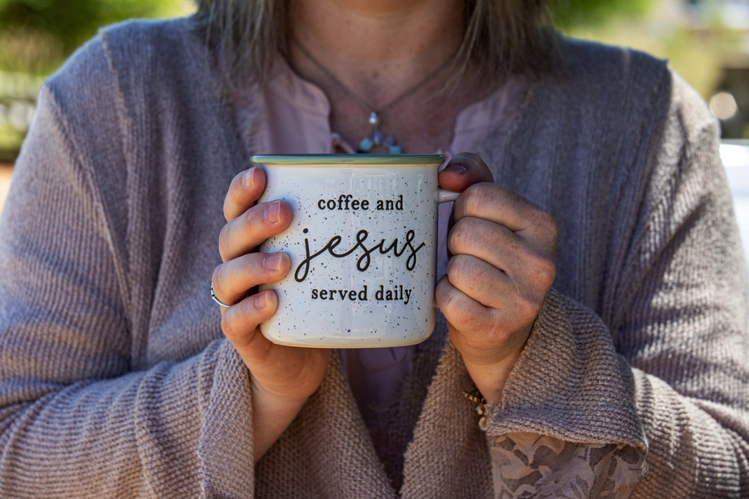 woman holding coffee cup