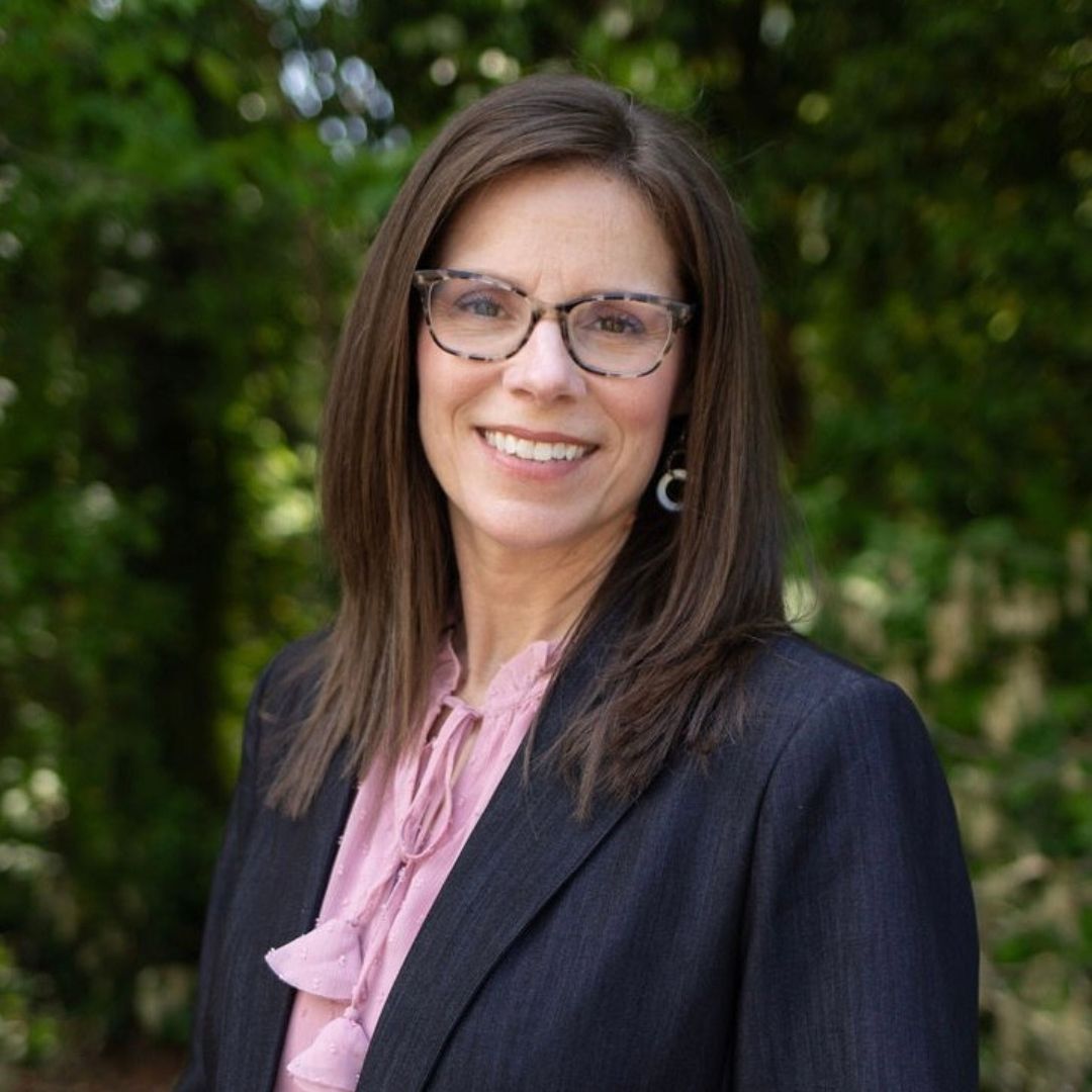 Jody Allen A woman with dark hair and glasses